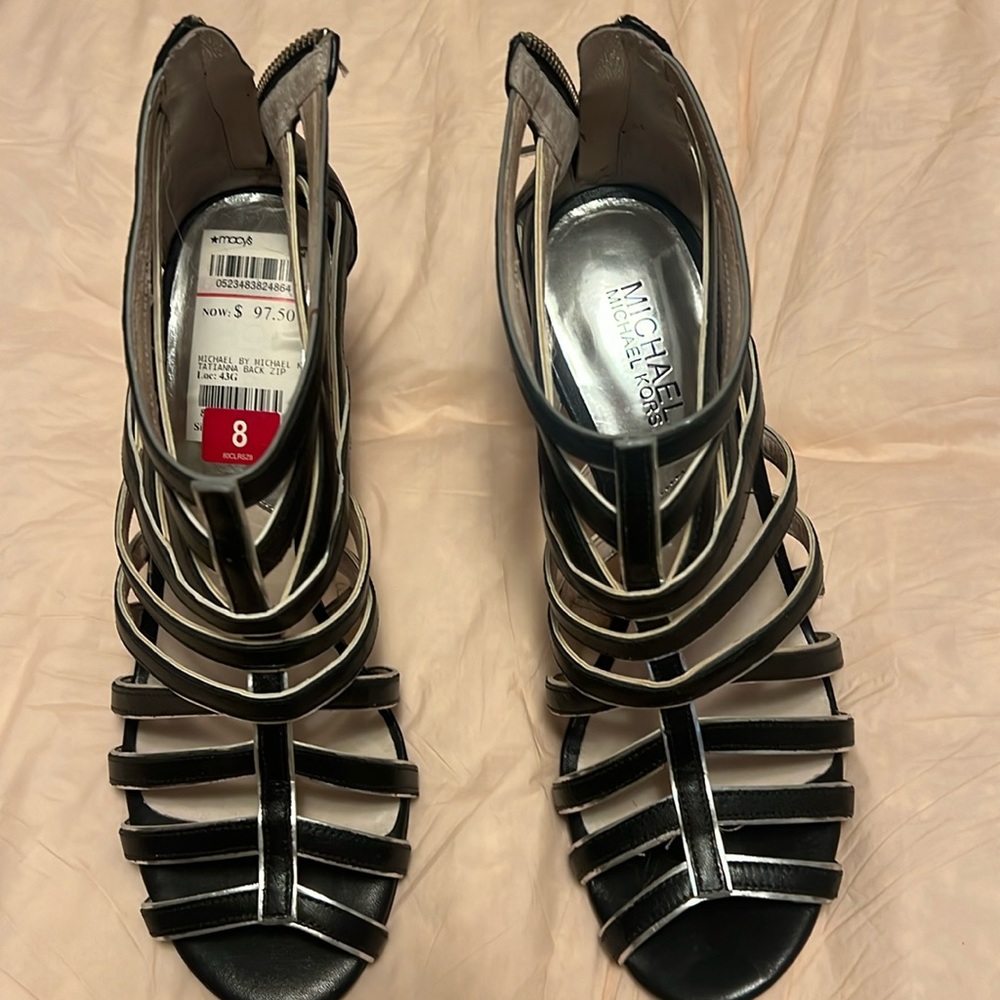 Black with silver trim high heel sandals size 8. Unique!